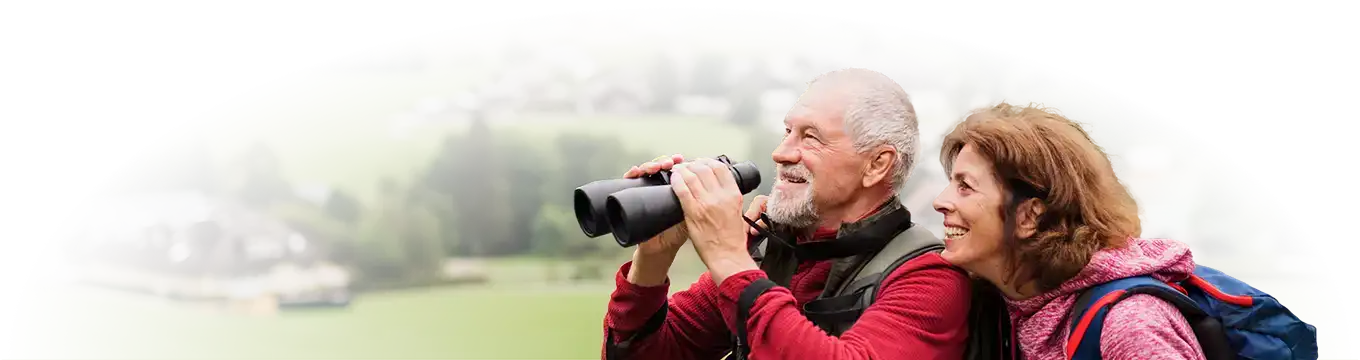 Couple looking through binoculars